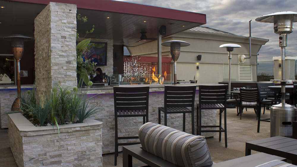 Outdoor Bar Stools with Fire Pit at Holiday Inn in Ontario Canada